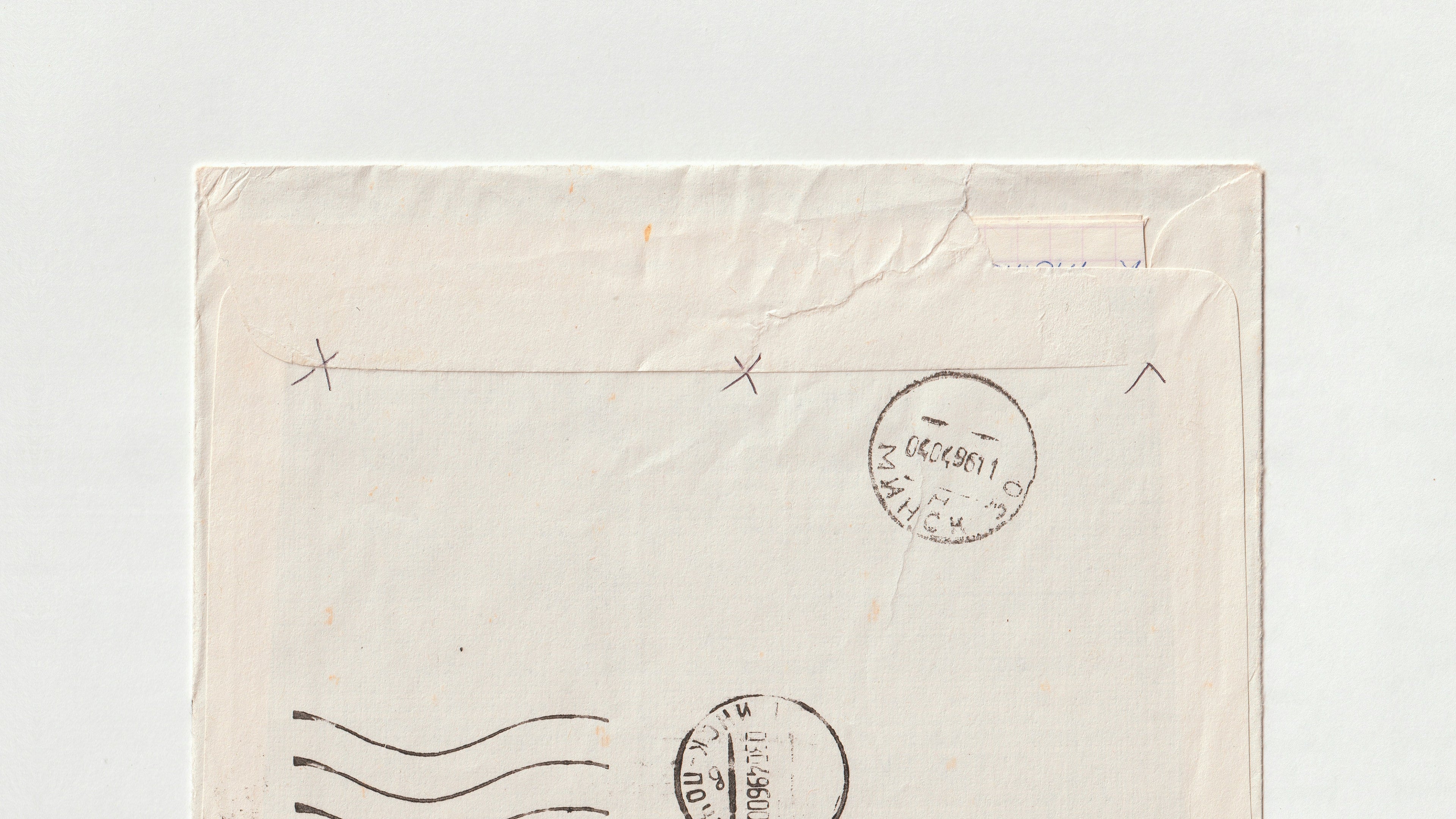 Vintage envelope with postage stamps on a light gray background